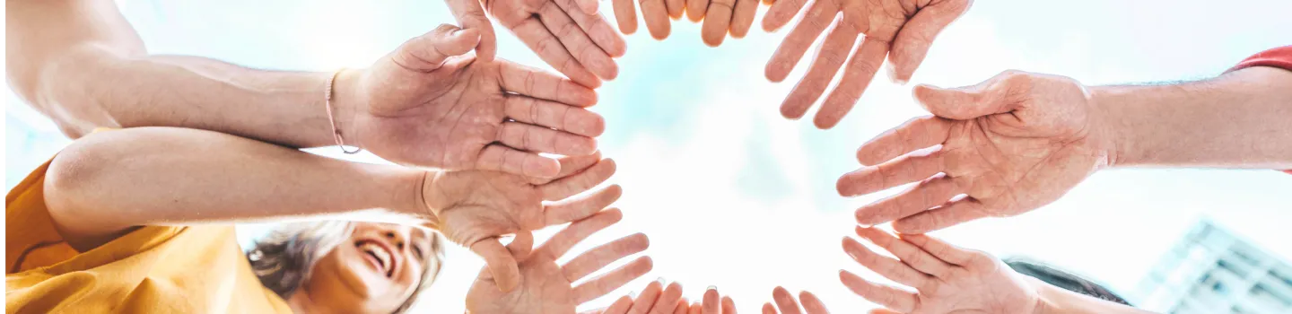 Group of hands depicting breaking away from inhibitions and discovering your inner strength